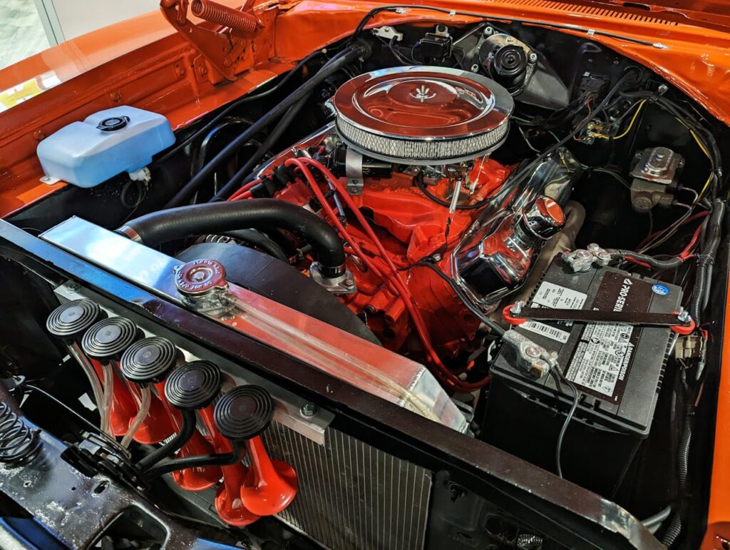pexels-photo-17356337 Detailed view of a vintage car engine showcasing components and intricate design.