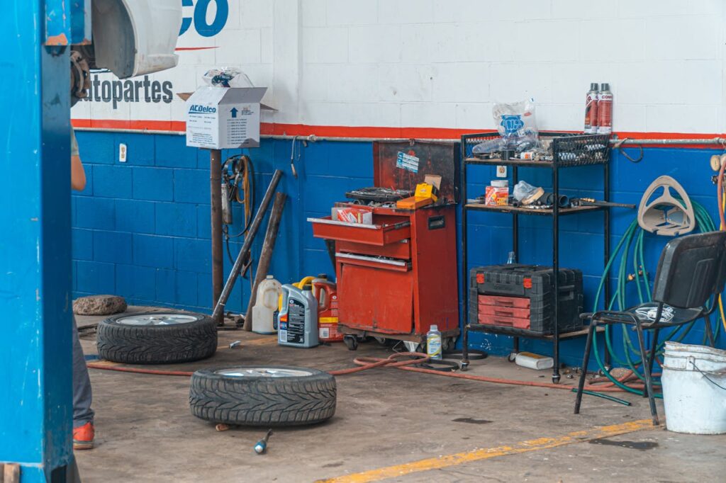 pexels-photo-4116291 A detailed view of an auto repair garage interior showcasing tools and equipment.
